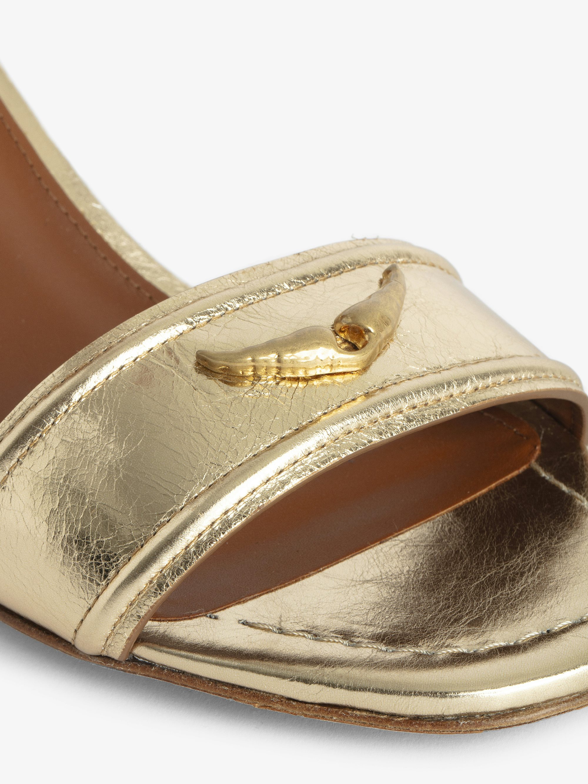 Caprese Sandals - Heeled sandals with leather strap adorned with a wing charm and a signature buckle.